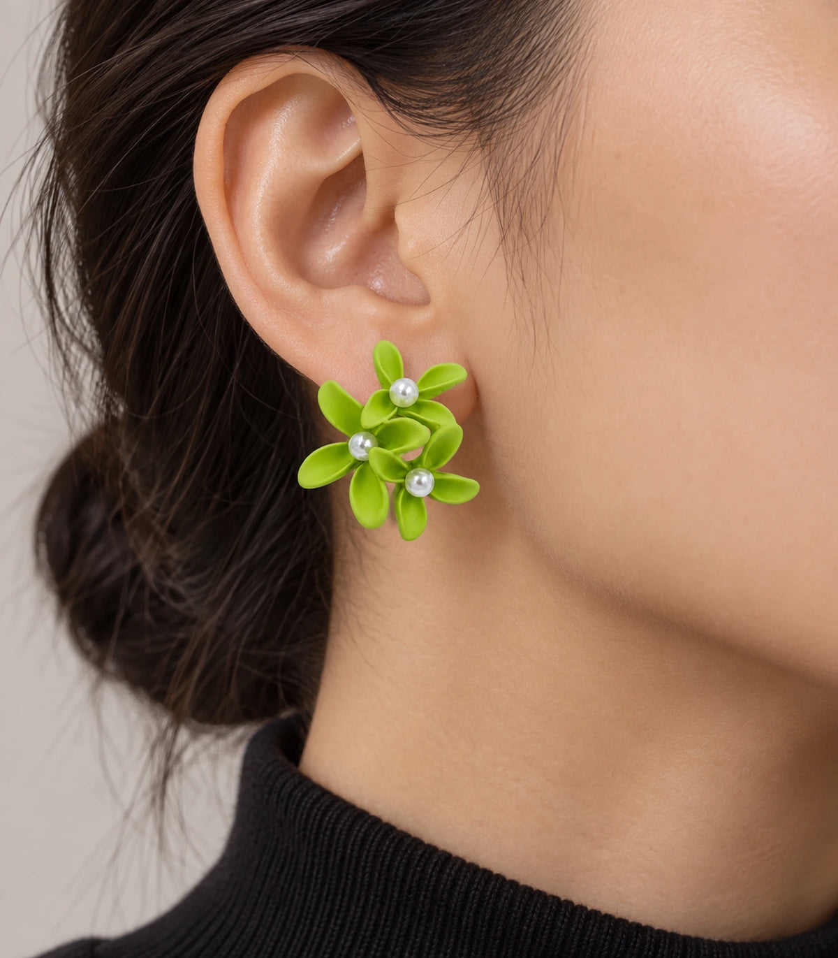 JIMIKI Lime cascading floral cluster stud earrings, worn on the ear with the floral cluster visible #color_lime