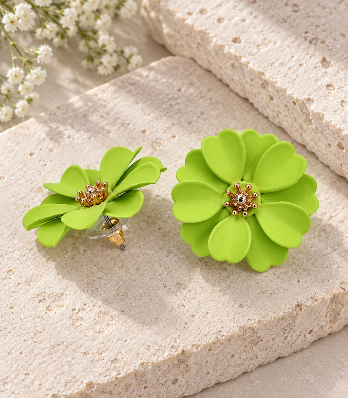 JIMIKI Lime Layered Daisy Stud Earrings - pair in styled flatlay #color_lime