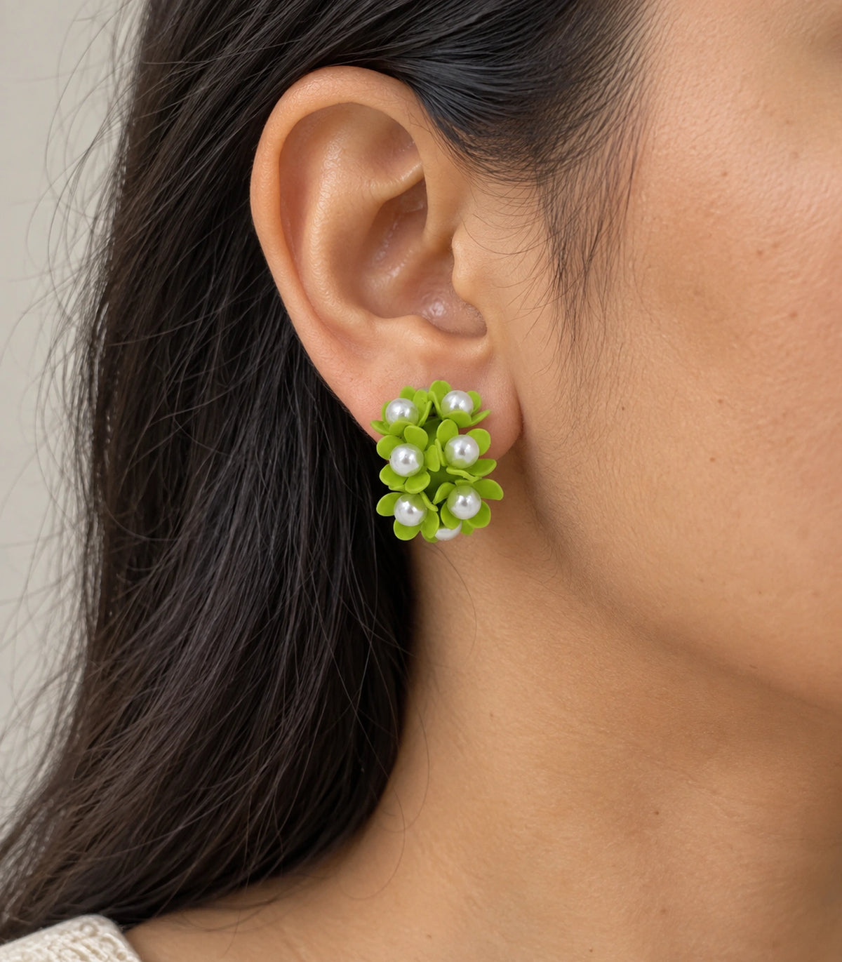 JIMIKI Lime pearl flower hoop earrings, worn on the ear with the floral cluster visible #color_lime