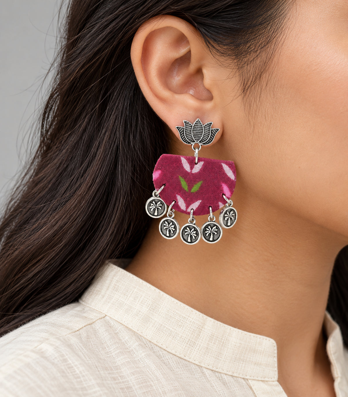 Magenta leaf fabric lotus coin earrings — closeup single earring detail