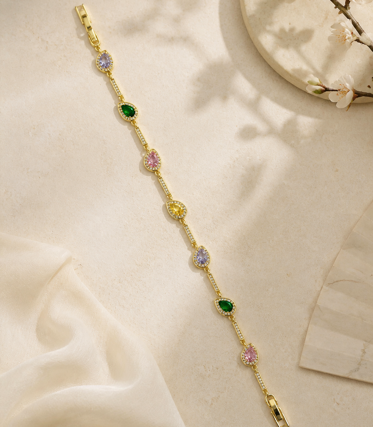 Multicolor Marquise Crystal Link Bracelet in an editorial flat lay