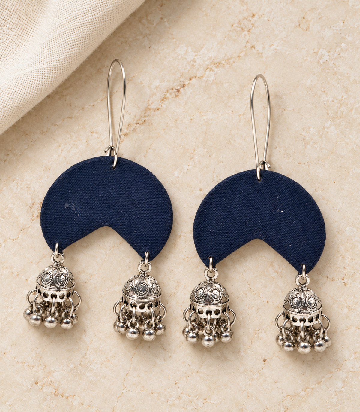 Navy crescent fabric double jhumka earrings – editorial flatlay