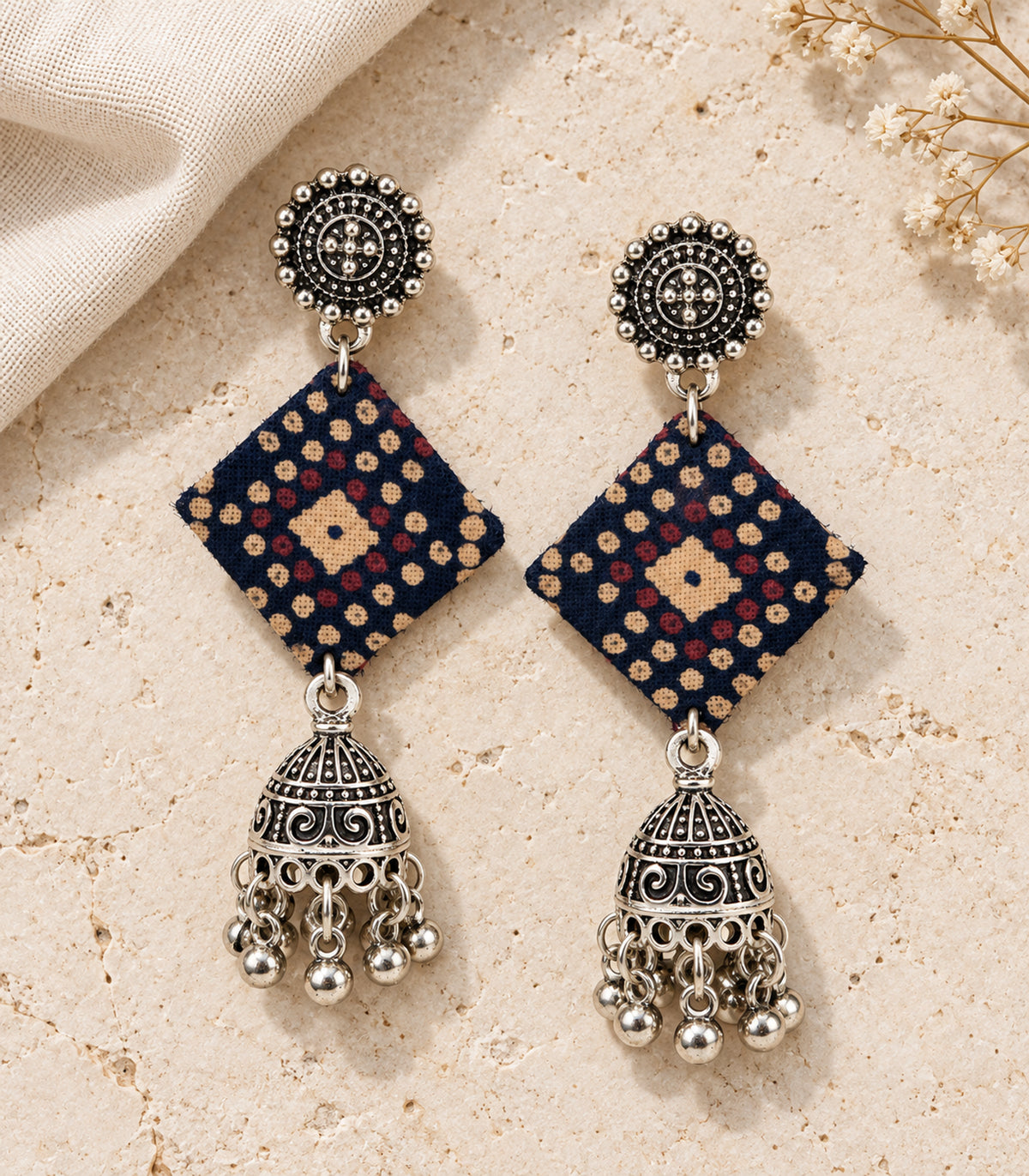 Navy dotted diamond fabric jhumka earrings — editorial flatlay