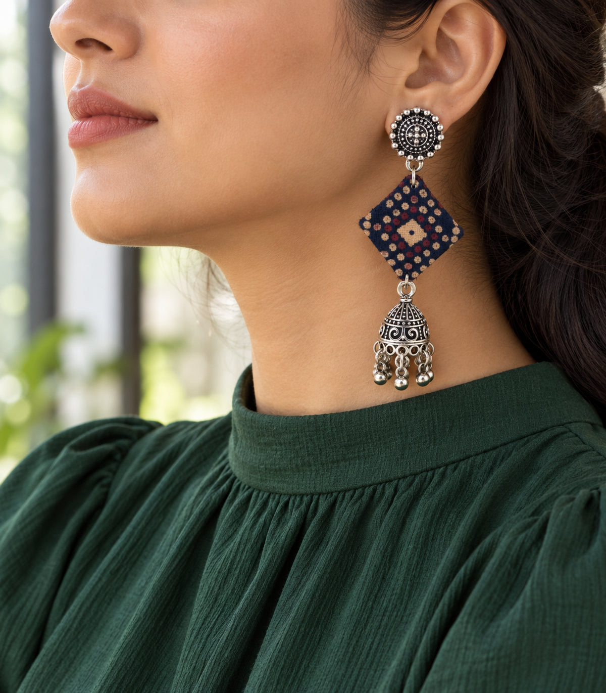 Navy dotted diamond fabric jhumka earrings — editorial model