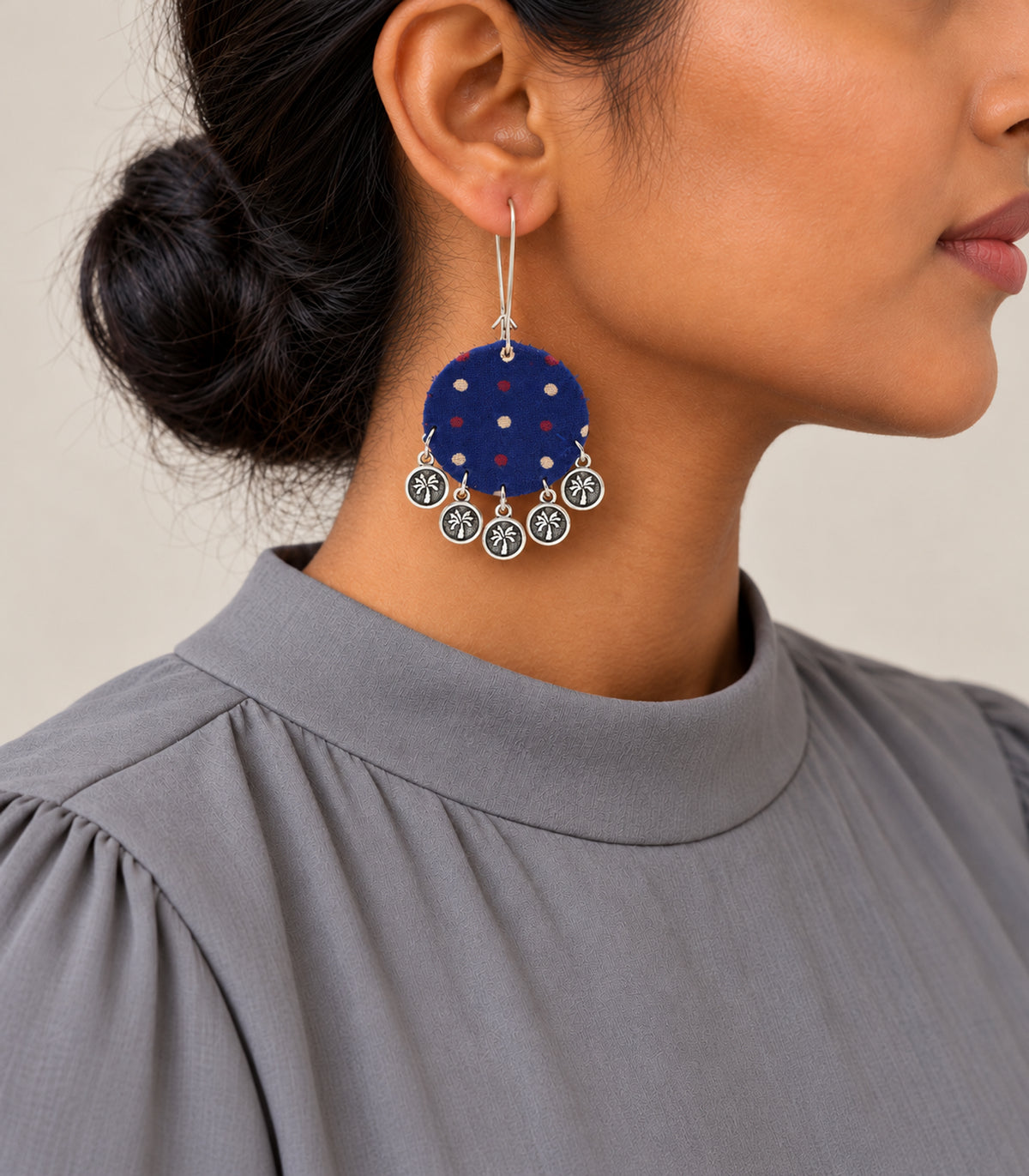 Navy dotted round fabric coin earrings - model view