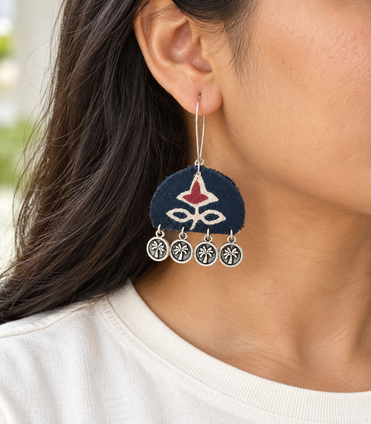 Navy and maroon floral coin drop earrings — closeup view