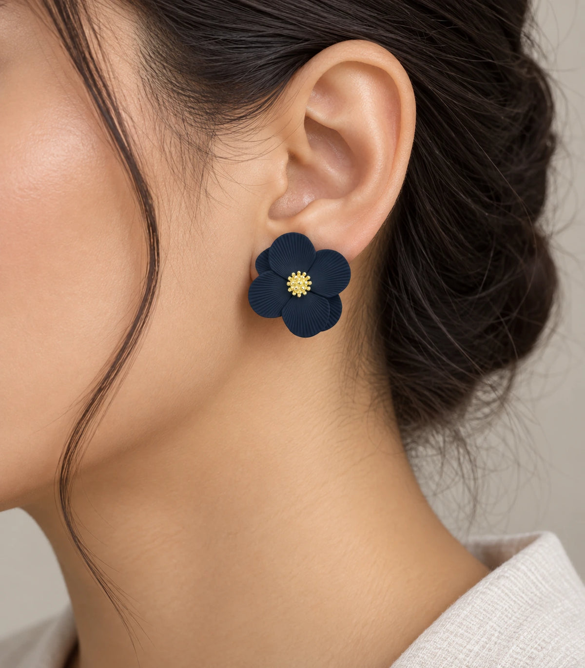 JIMIKI Navy ribbed flower stud earrings, worn view showing the flower stud #color_navy