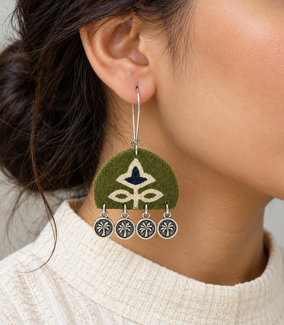 Olive and navy floral coin drop earrings — closeup view