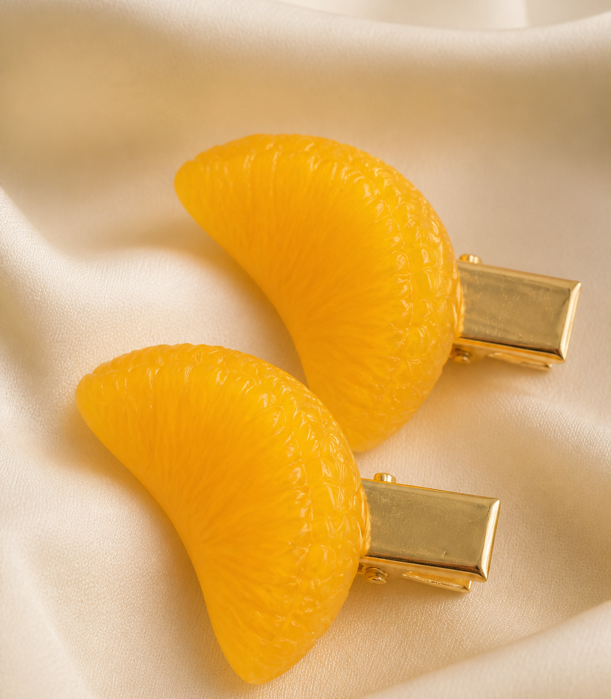 Orange Segment Barrette Pair close-up view