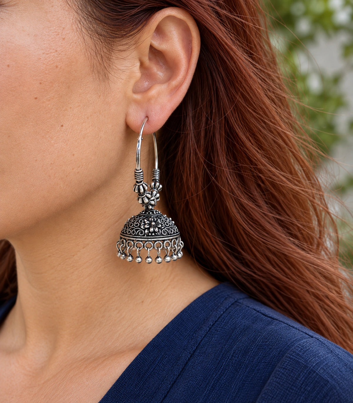 JIMIKI Beaded Hoop Floral Jhumka Earrings - Oxidized Silver close-up of earring worn on the ear #color_oxidized-silver