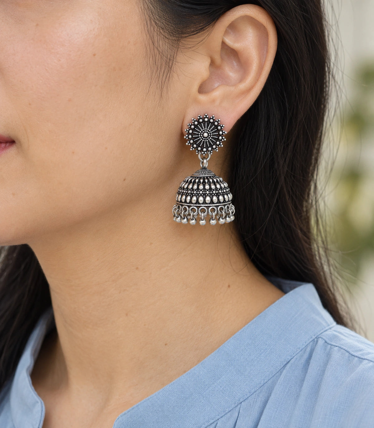 JIMIKI Oxidized Silver Beaded Sunburst Jhumka Earrings - earring worn with a clear view of the design #color_oxidized-silver