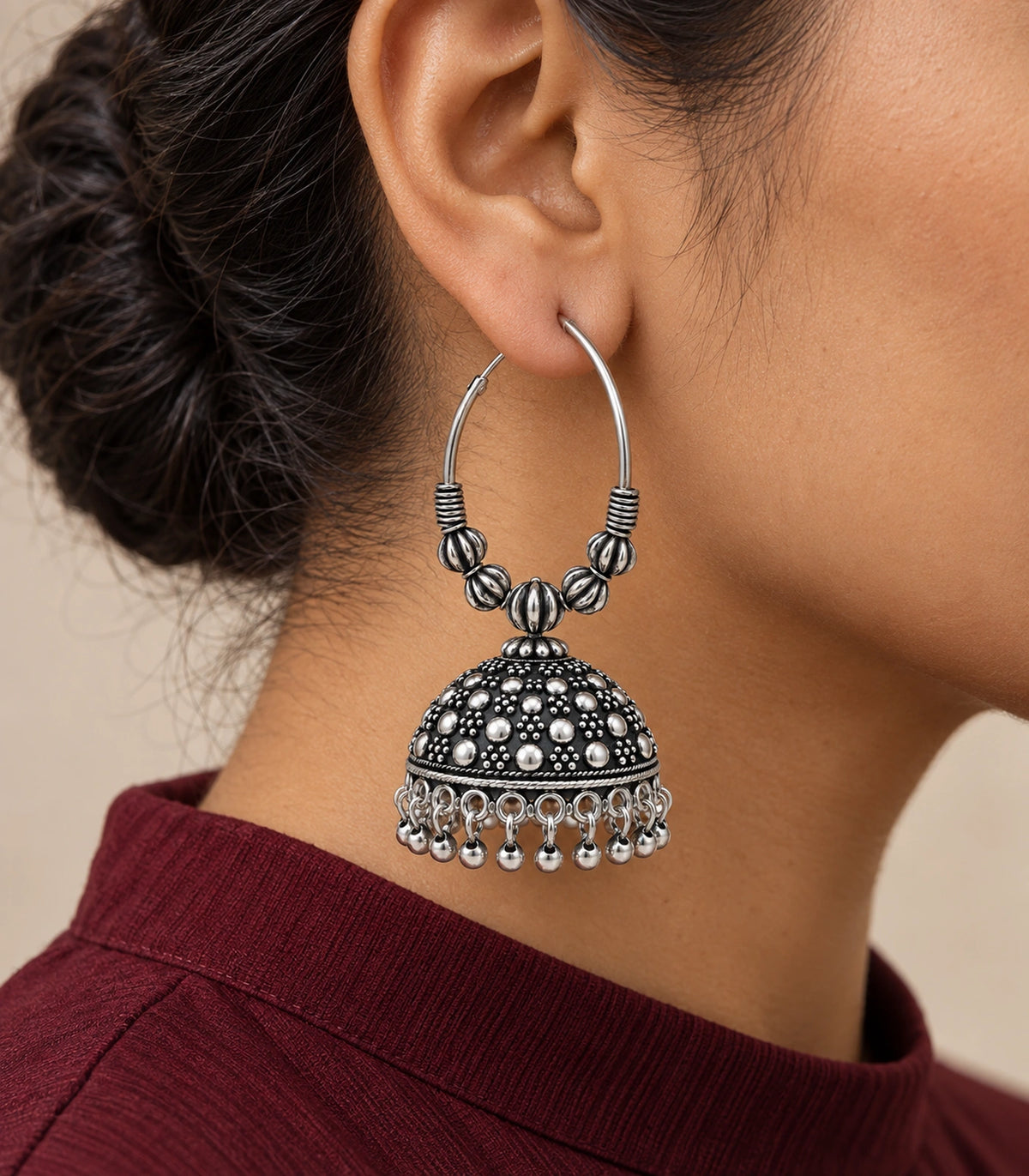 JIMIKI Oxidized Silver Five Bead Hoop Dotted Jhumka Earrings in Oxidized Silver - editorial worn view #color_oxidized-silver
