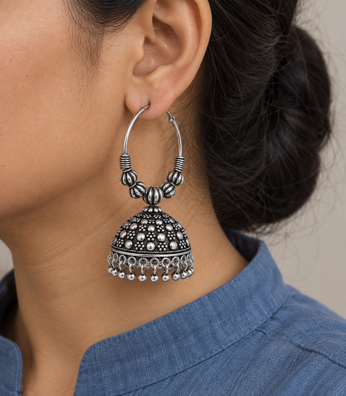 JIMIKI Oxidized Silver Five Bead Hoop Dotted Jhumka Earrings in Oxidized Silver - worn styling view #color_oxidized-silver