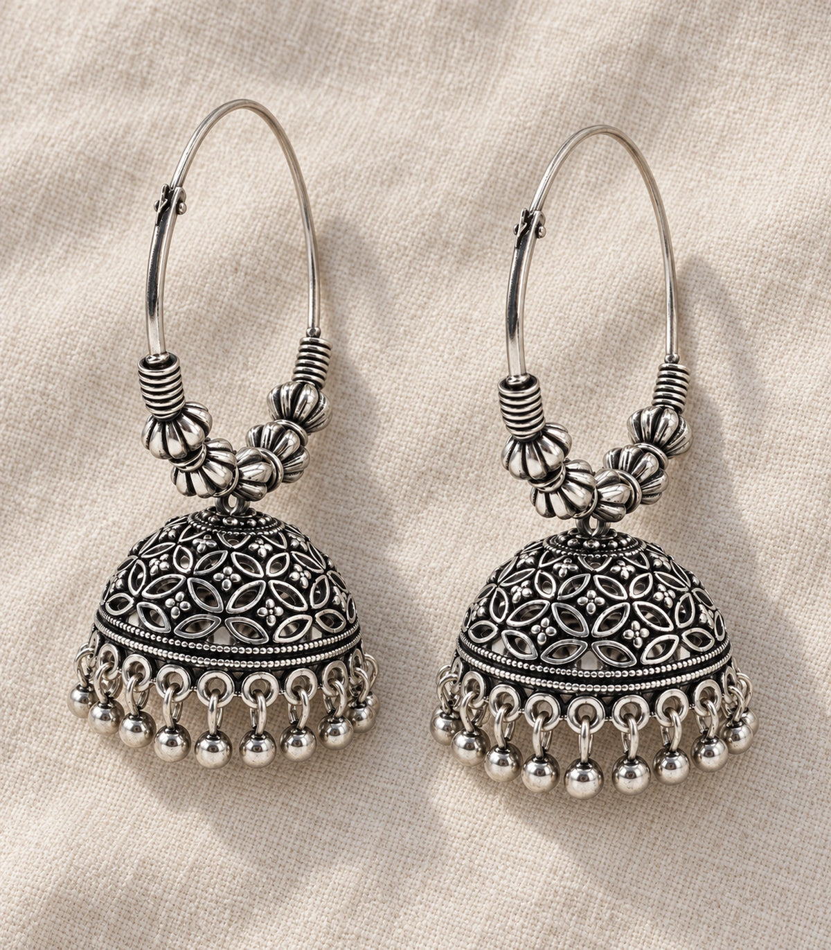 JIMIKI Oxidized Silver Floral Lattice Beaded Hoop Jhumka Earrings - Pair arranged in an editorial flatlay #color_oxidized-silver