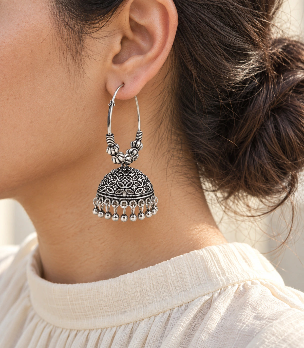 JIMIKI Oxidized Silver Floral Lattice Beaded Hoop Jhumka Earrings - Editorial worn view #color_oxidized-silver