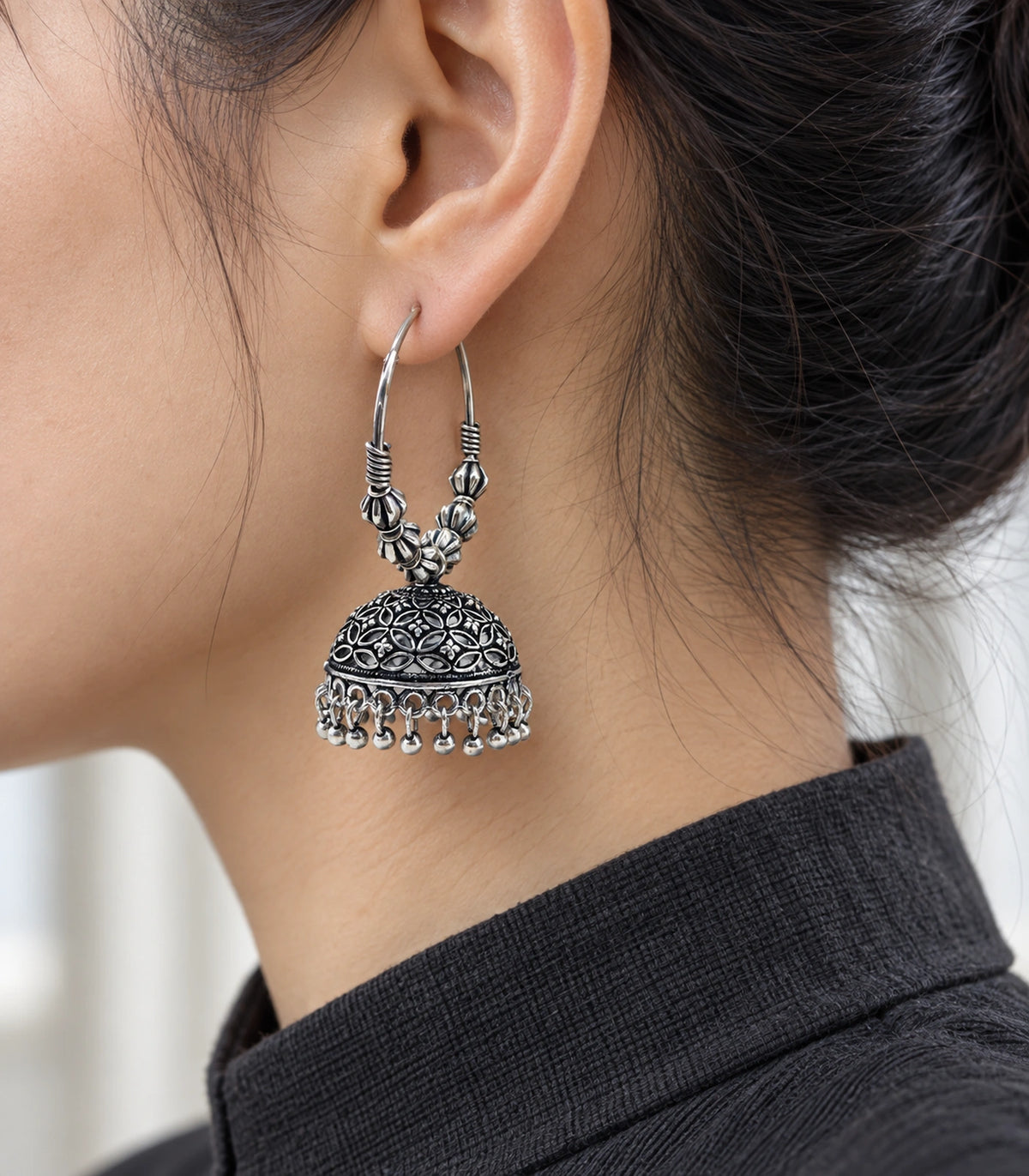 JIMIKI Oxidized Silver Floral Lattice Hoop Jhumka Earrings - Oxidized Silver earring in a styled model view #color_oxidized-silver