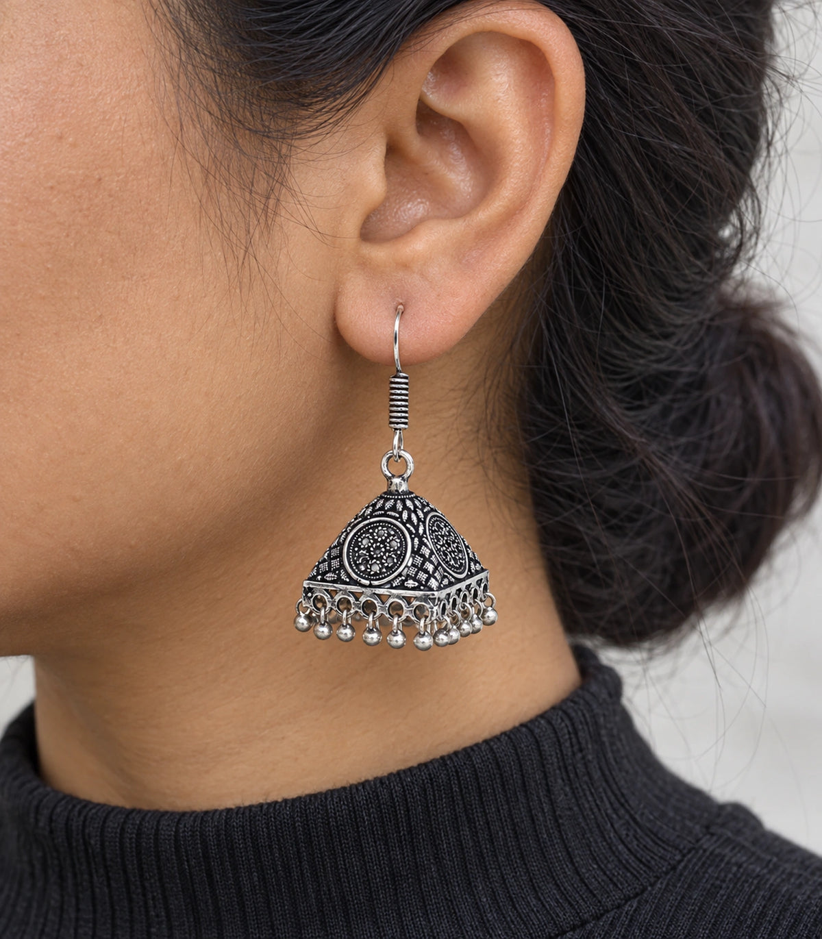 JIMIKI Oxidized Silver Floral Medallion Pyramid Jhumka Earrings - Close-up of the earring details #color_oxidized-silver
