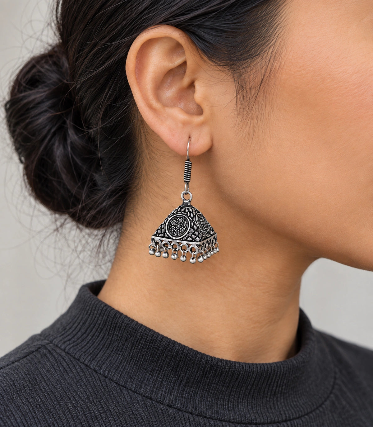 JIMIKI Oxidized Silver Floral Medallion Pyramid Jhumka Earrings - Worn styling view #color_oxidized-silver