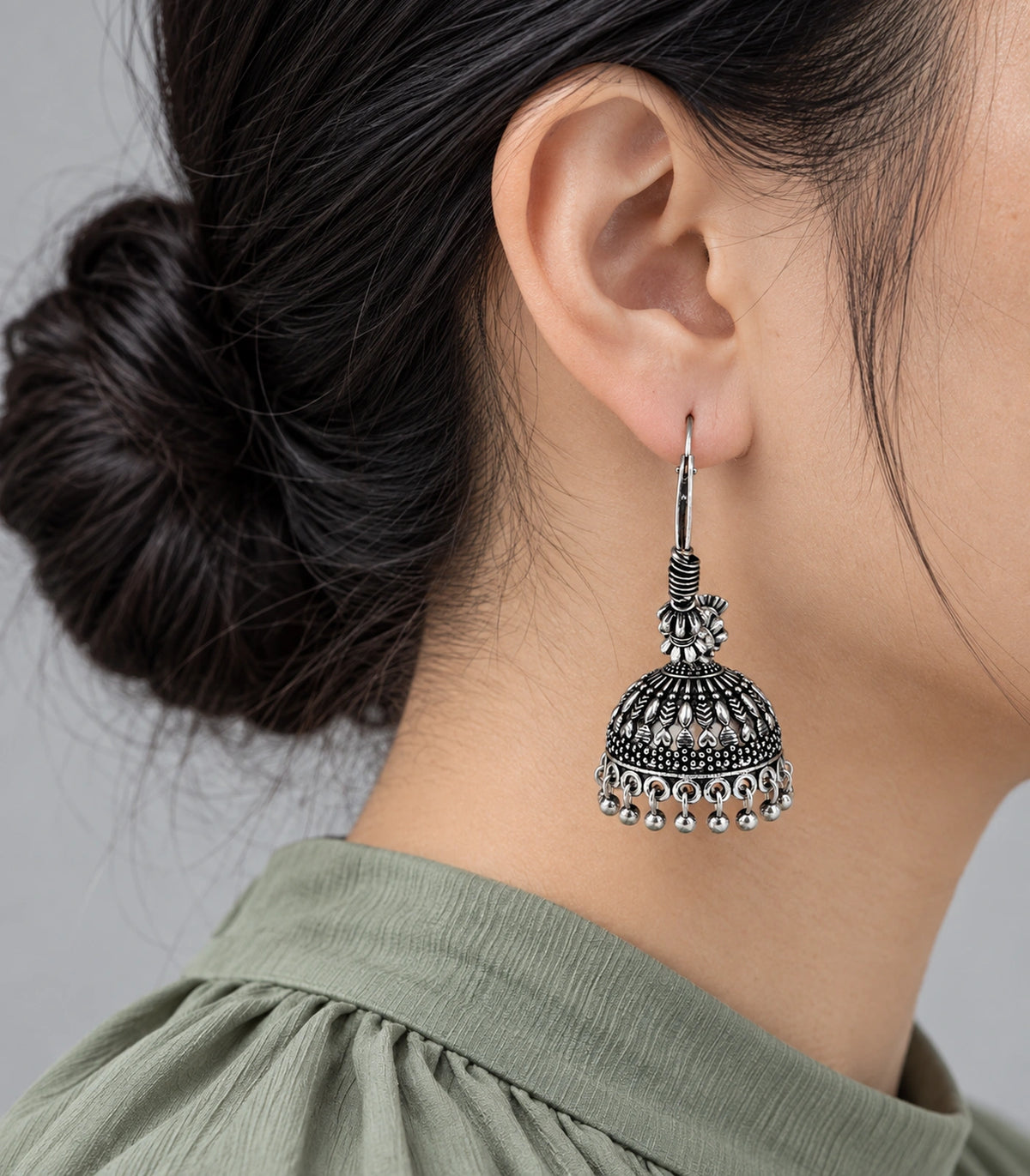 JIMIKI Oxidized Silver Leaf Chevron Hoop Jhumka Earrings - styled model wearing the earring #color_oxidized-silver
