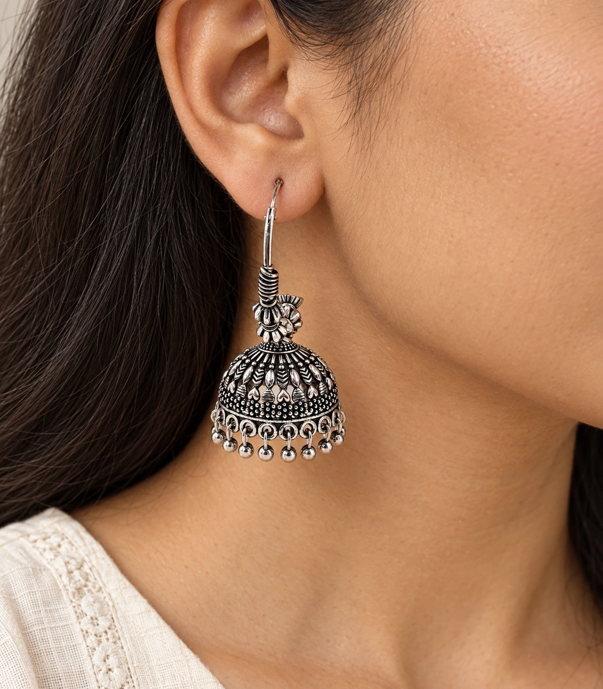 JIMIKI Oxidized Silver Leaf Chevron Hoop Jhumka Earrings - earring worn with a clear view of the design #color_oxidized-silver