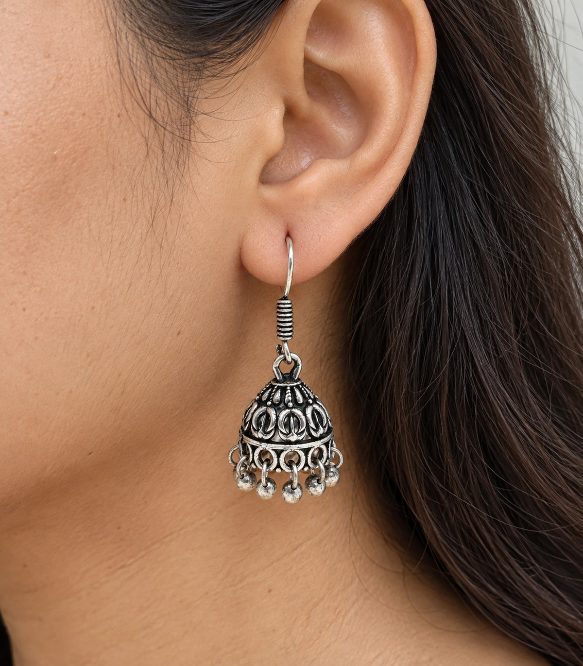 JIMIKI Oxidized Silver Leaf Motif Mini Jhumka Earrings - close-up of the earring worn #color_oxidized-silver