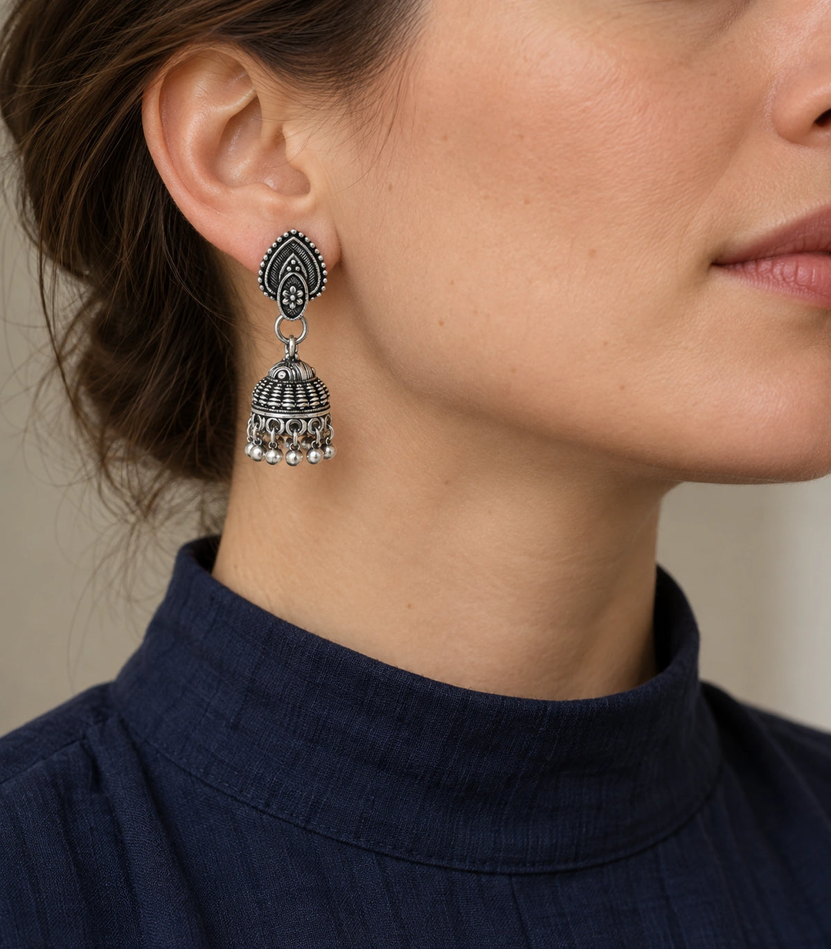 JIMIKI Leaf Stud Beaded Jhumka Earrings - Oxidized Silver styled model wearing the earring #color_oxidized-silver