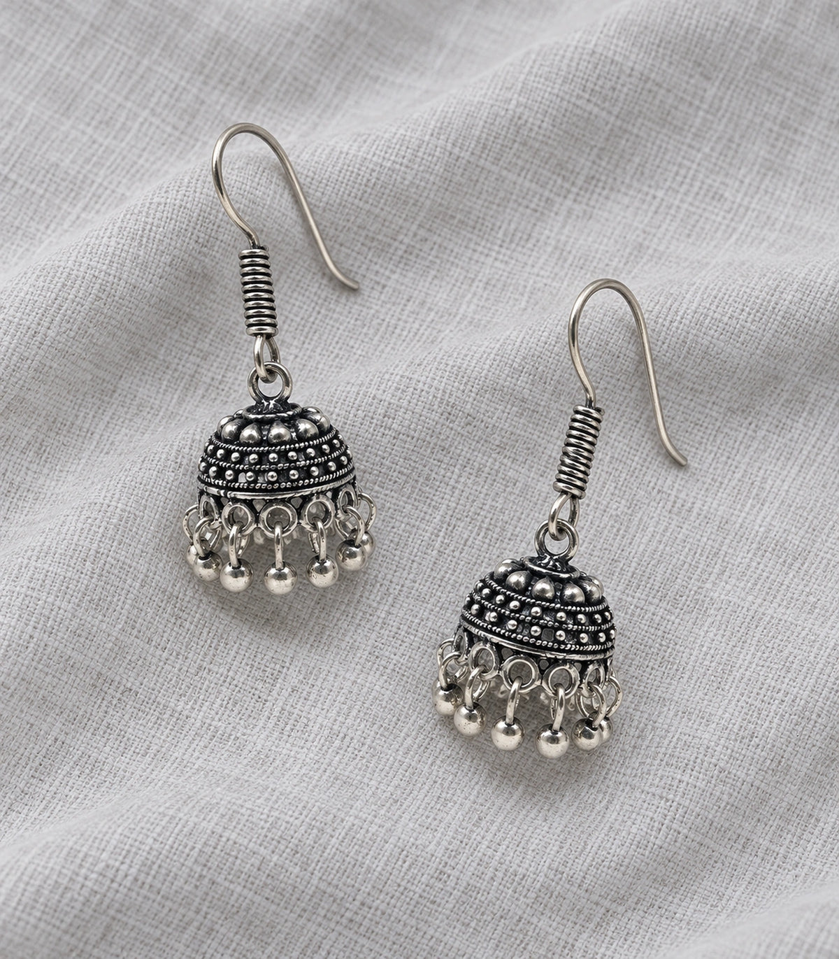 JIMIKI Oxidized Silver Mini Beaded Dome Hook Jhumka Earrings in Oxidized Silver - editorial flatlay #color_oxidized-silver