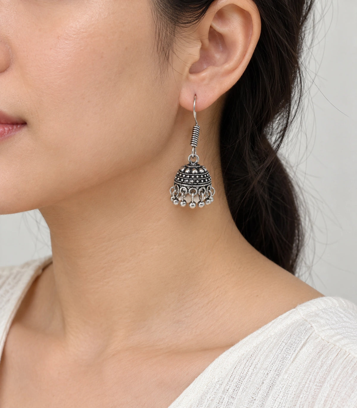JIMIKI Oxidized Silver Mini Beaded Dome Hook Jhumka Earrings in Oxidized Silver - worn styling view #color_oxidized-silver