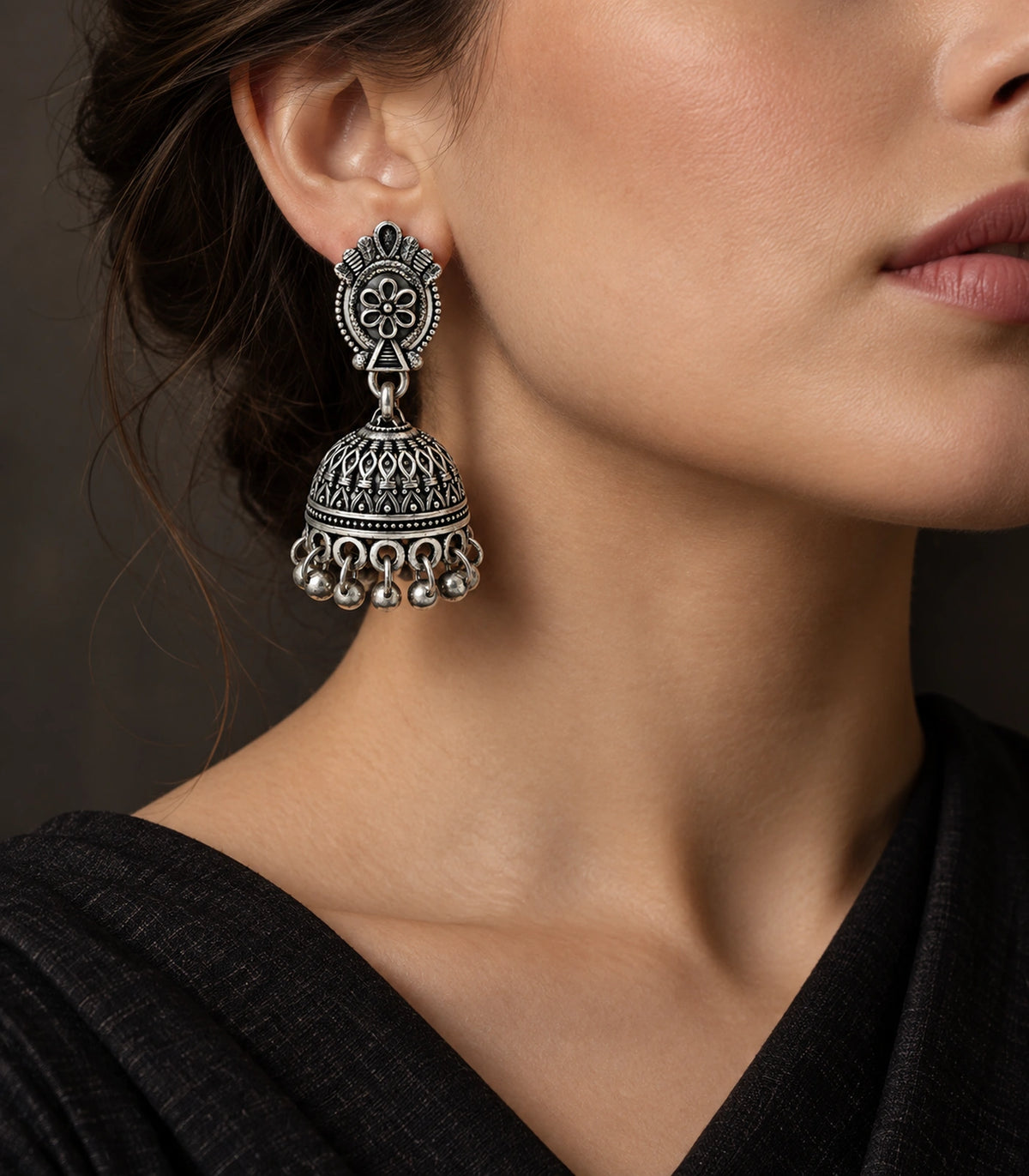 JIMIKI Oxidized Silver Oval Floral Jhumka Earrings - Earring styled with a black outfit #color_oxidized-silver