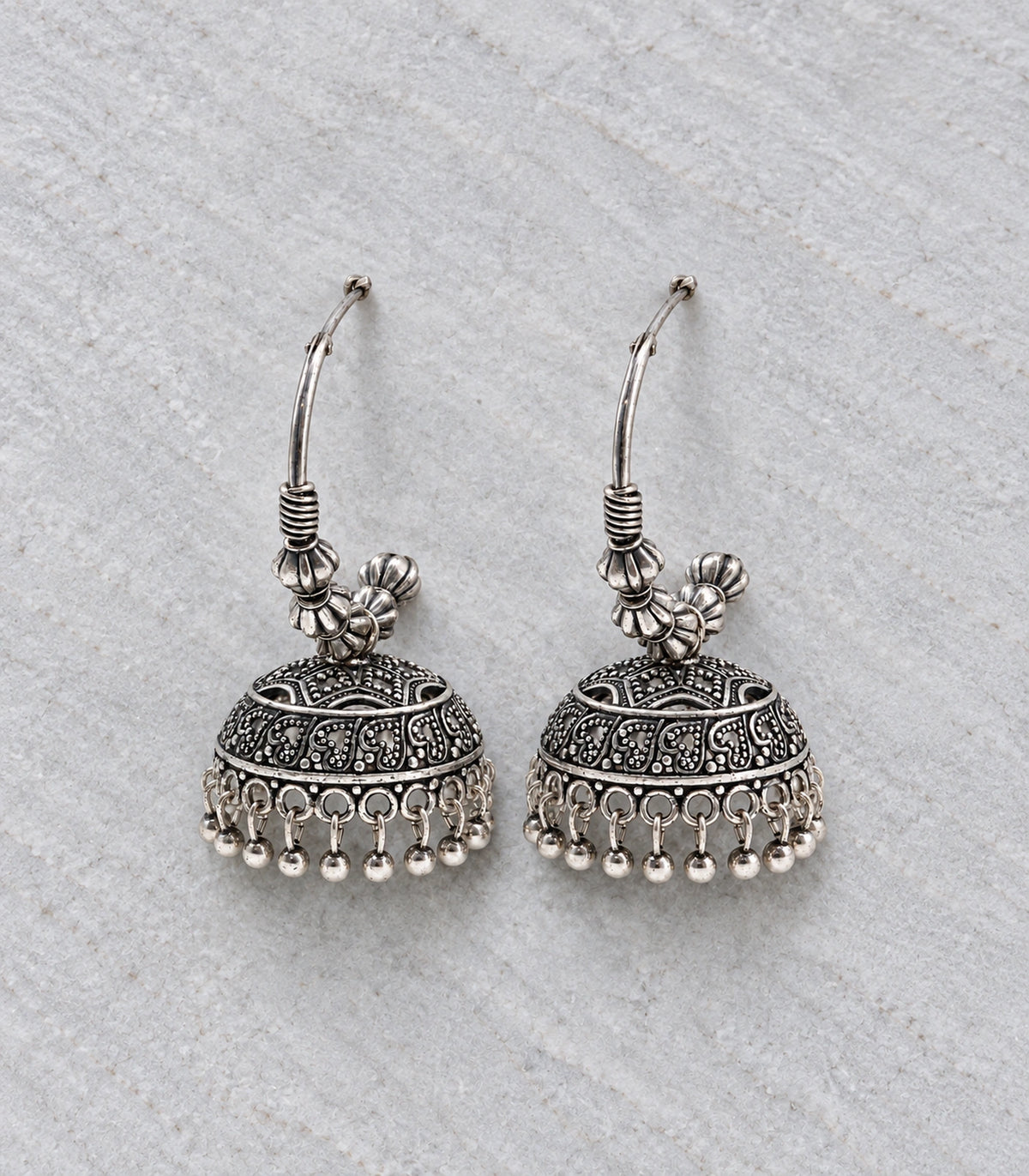 JIMIKI Paisley Beaded Hoop Jhumka Earrings in Oxidized Silver - editorial flatlay #color_oxidized-silver