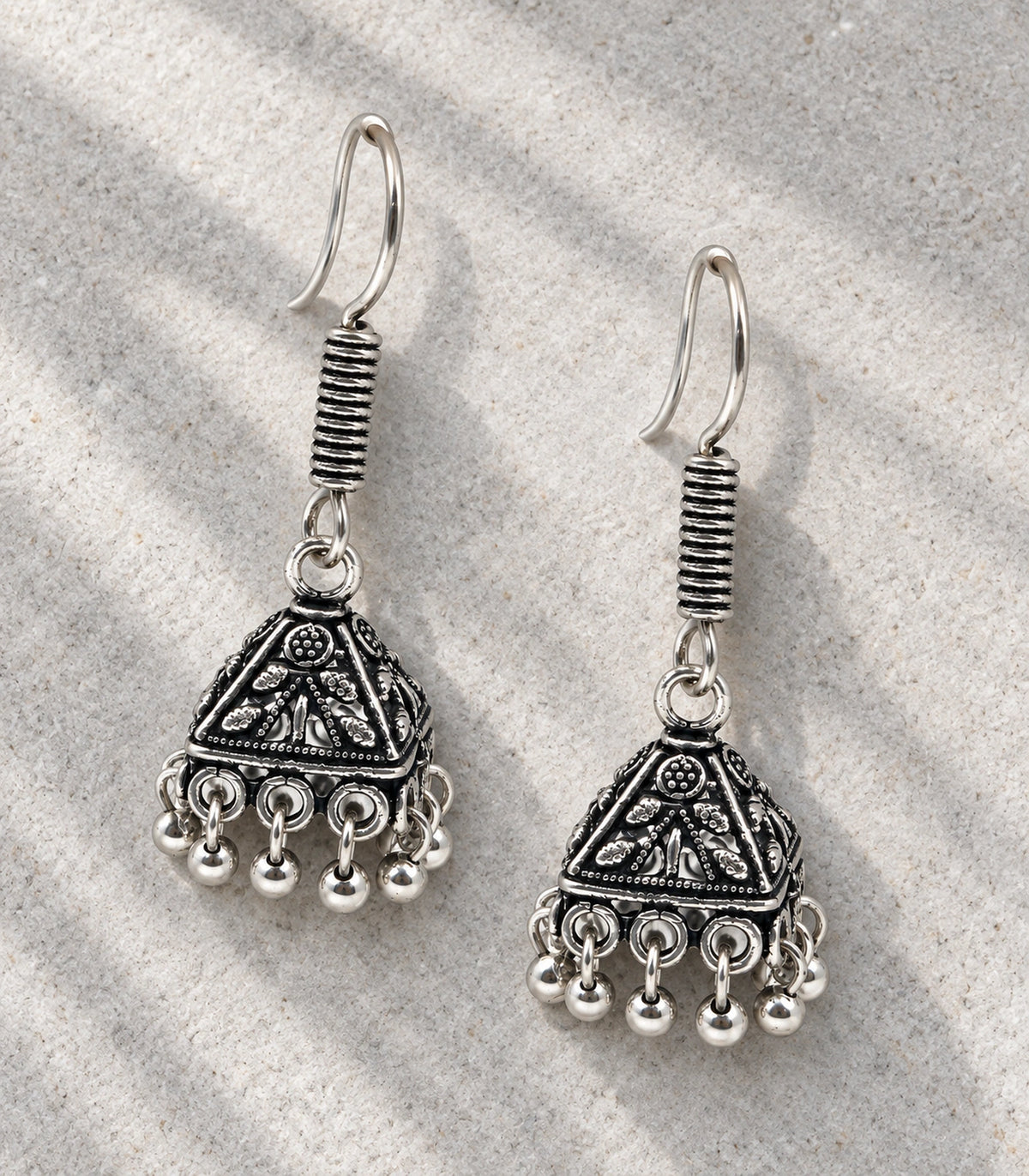JIMIKI Pyramid Floral Hook Jhumka Earrings in Oxidized Silver - editorial flatlay #color_oxidized-silver