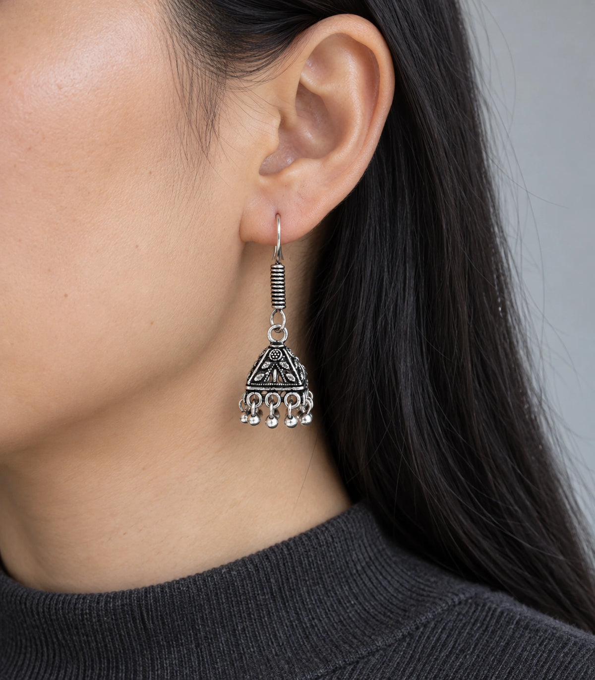 JIMIKI Pyramid Floral Hook Jhumka Earrings in Oxidized Silver - worn styling view #color_oxidized-silver
