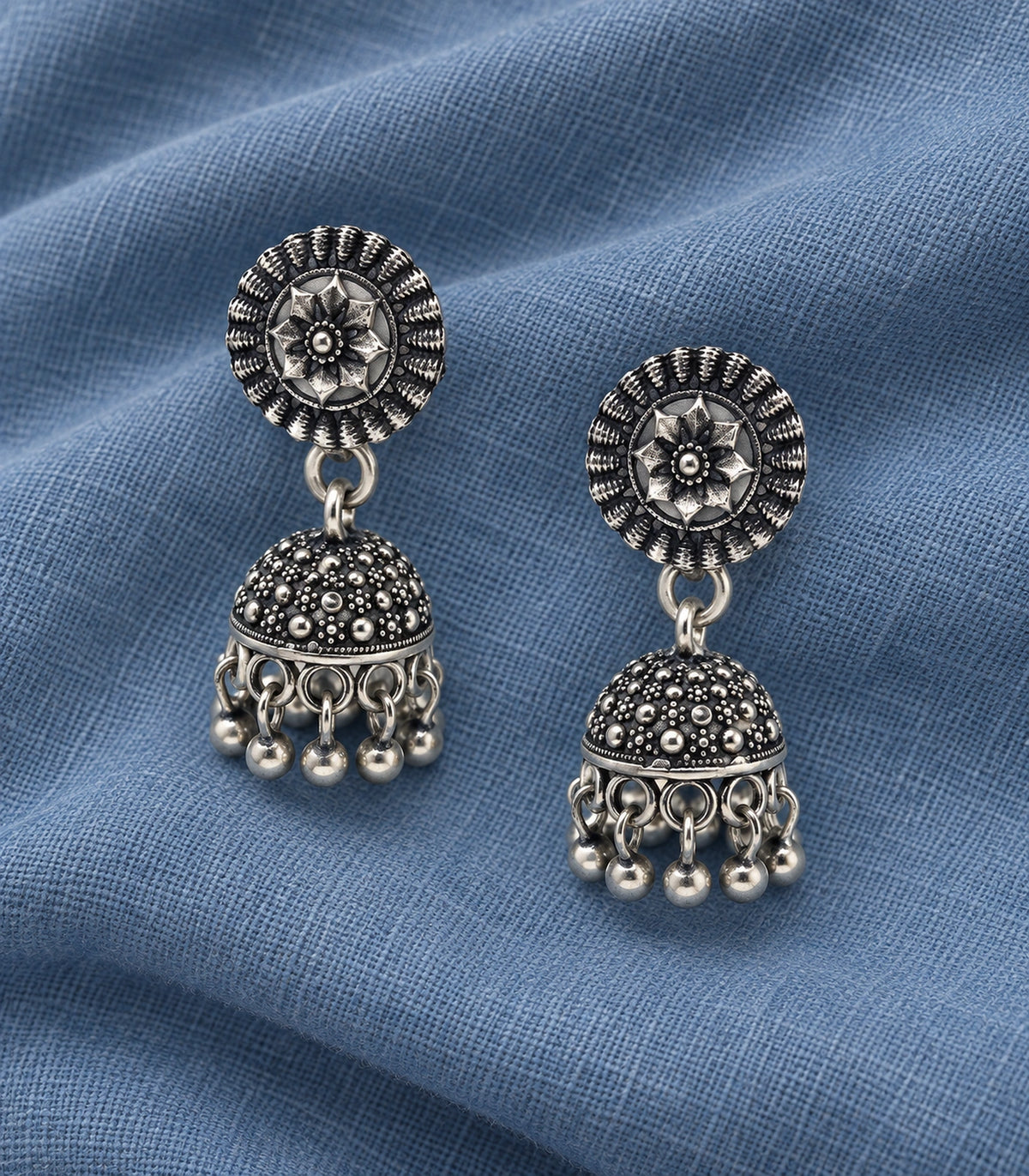 JIMIKI Oxidized Silver Rosette Stud Dotted Jhumka Earrings in Oxidized Silver - editorial flatlay #color_oxidized-silver