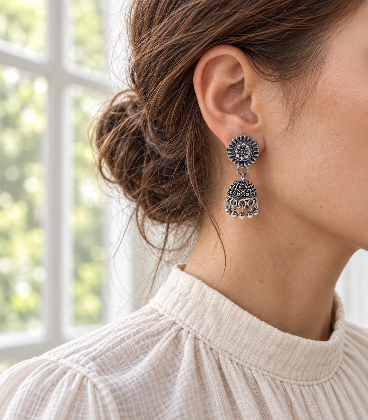 JIMIKI Oxidized Silver Rosette Stud Dotted Jhumka Earrings in Oxidized Silver - editorial worn view #color_oxidized-silver