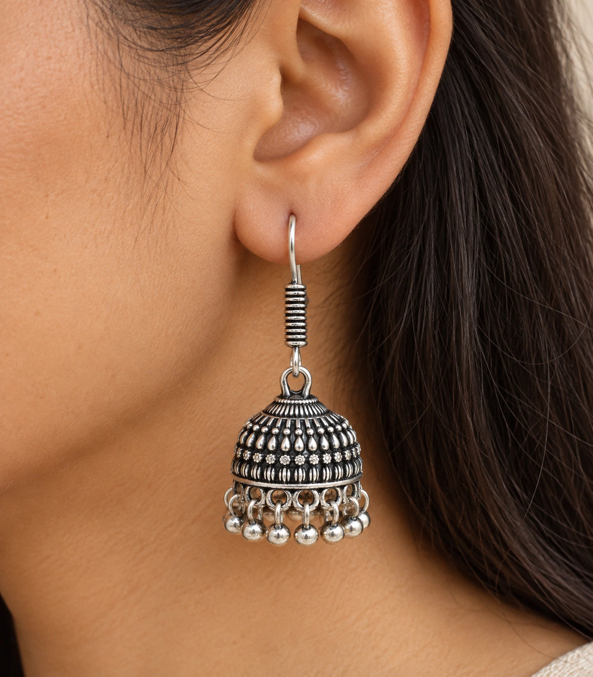 JIMIKI Oxidized Silver Rosette Teardrop Jhumka Earrings - close-up of the earring worn #color_oxidized-silver