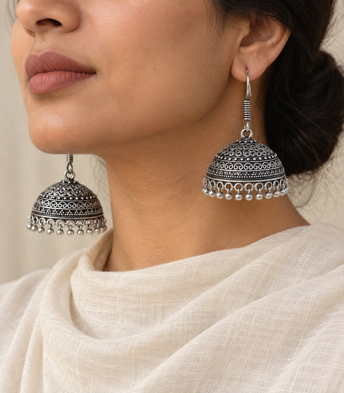 JIMIKI Oxidized Silver Scroll Dome Hook Jhumka Earrings - Oxidized Silver styled model wearing the earring #color_oxidized-silver