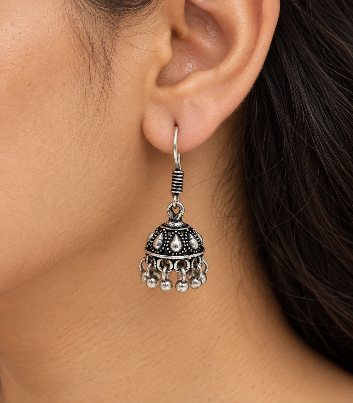 JIMIKI Oxidized Silver Teardrop Mini Jhumka Earrings - close-up of the earring worn #color_oxidized-silver
