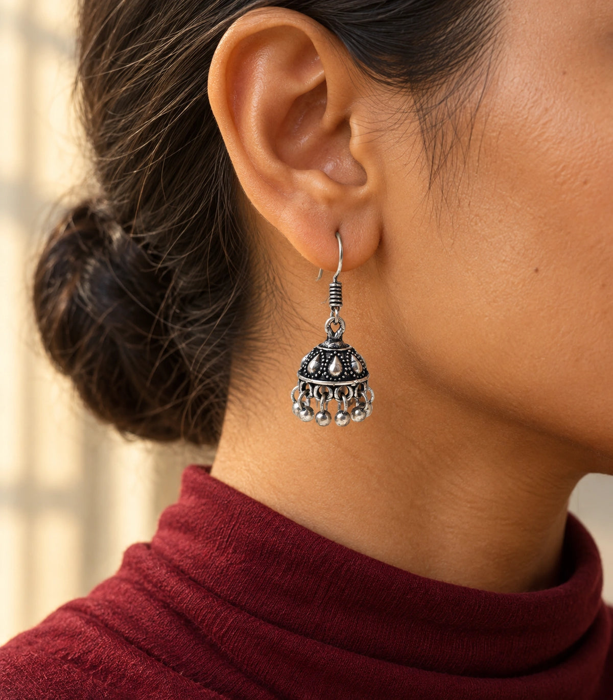 JIMIKI Oxidized Silver Teardrop Mini Jhumka Earrings - styled model wearing the earring #color_oxidized-silver