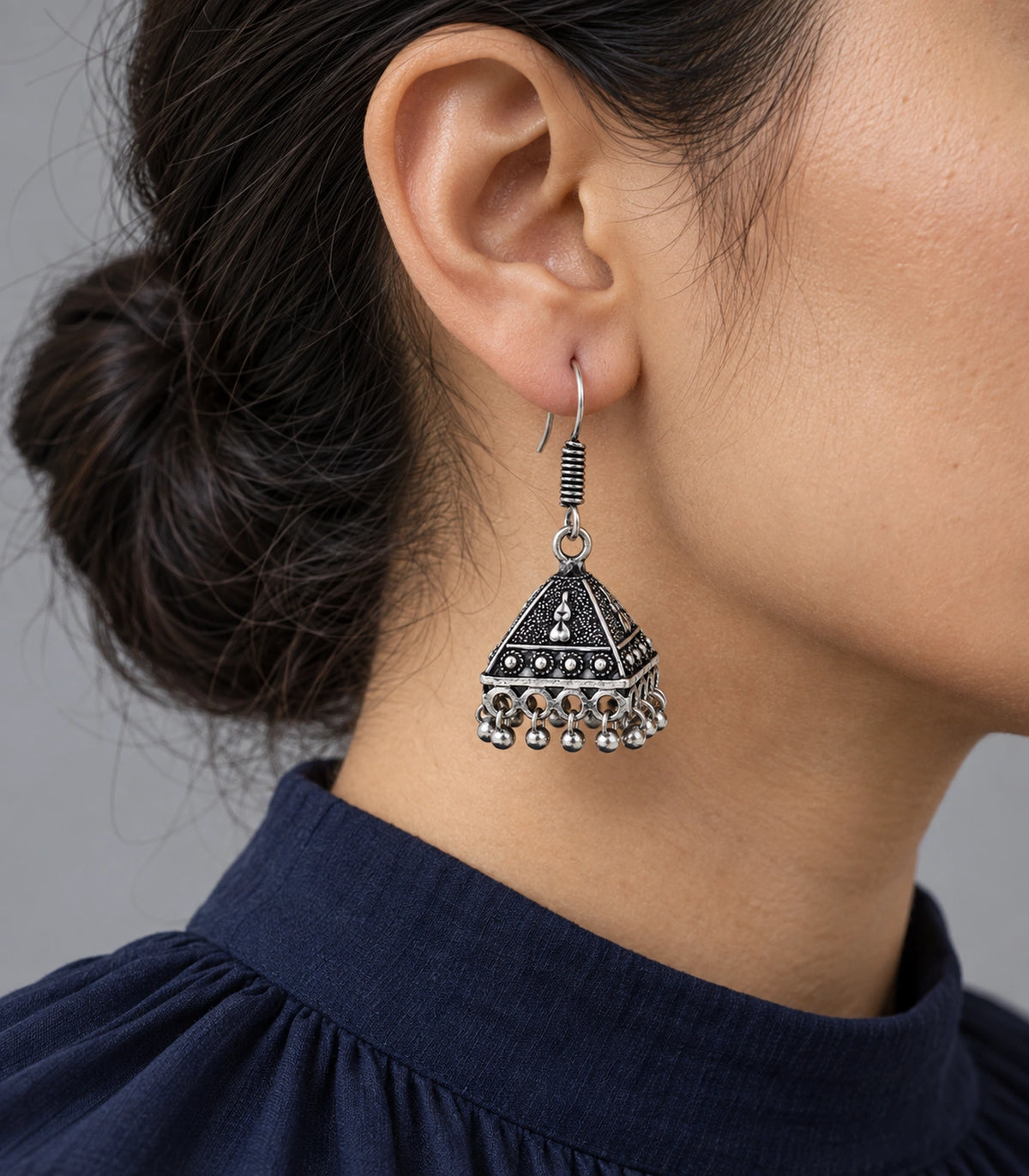 JIMIKI Oxidized Silver Teardrop Pyramid Jhumka Earrings - Editorial worn view #color_oxidized-silver