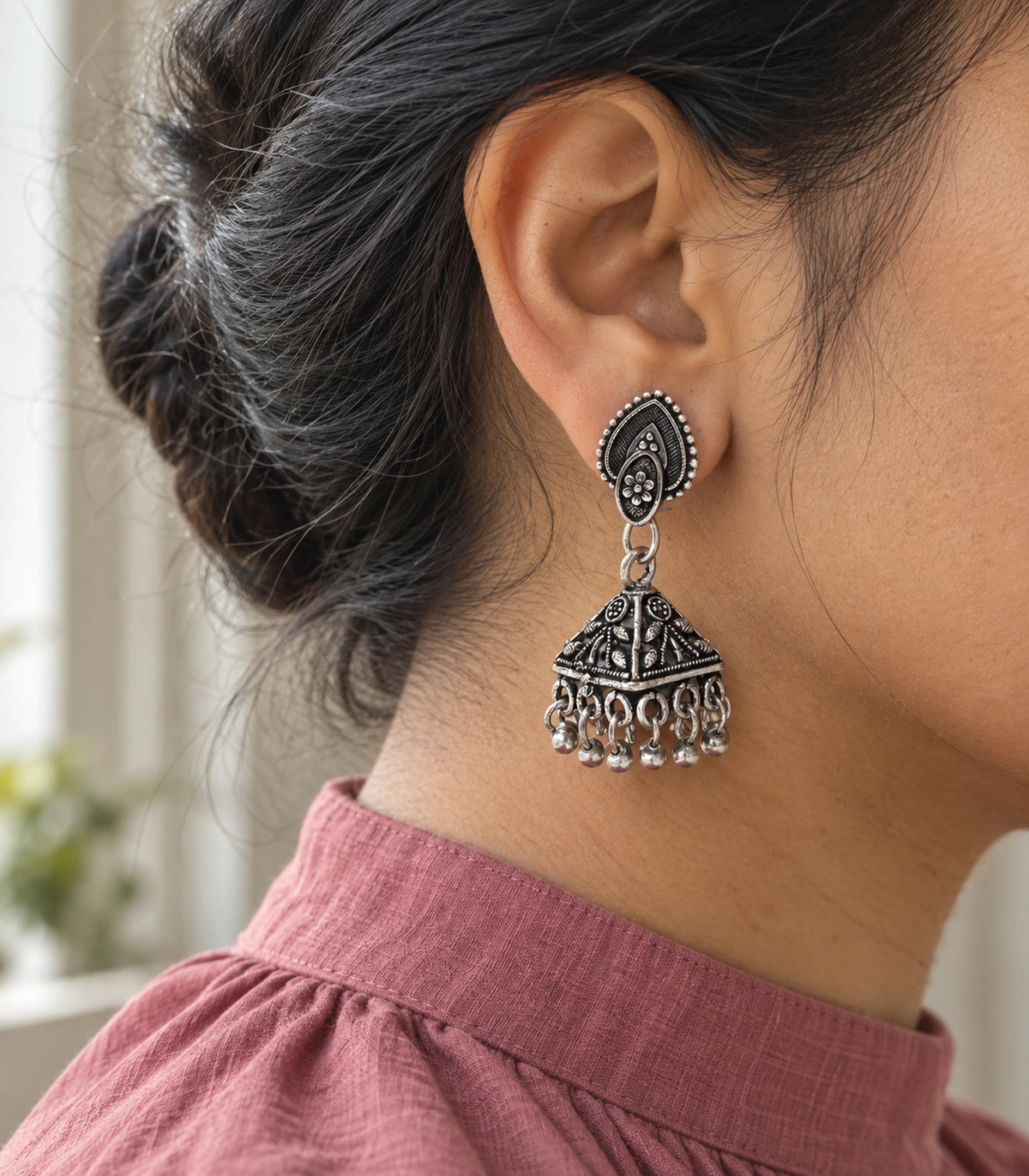 JIMIKI Oxidized Silver Teardrop Stud Floral Pyramid Jhumka Earrings in Oxidized Silver - editorial worn view #color_oxidized-silver