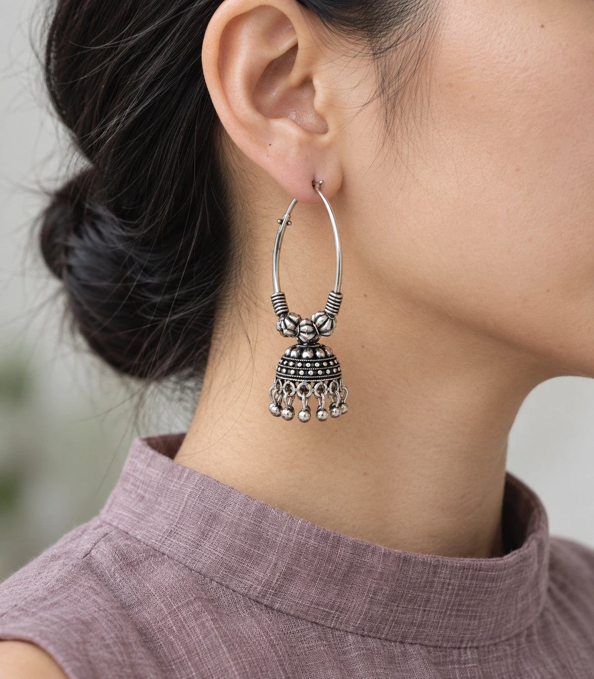 JIMIKI Oxidized Silver Three Bead Hoop Banded Jhumka Earrings in Oxidized Silver - editorial worn view #color_oxidized-silver