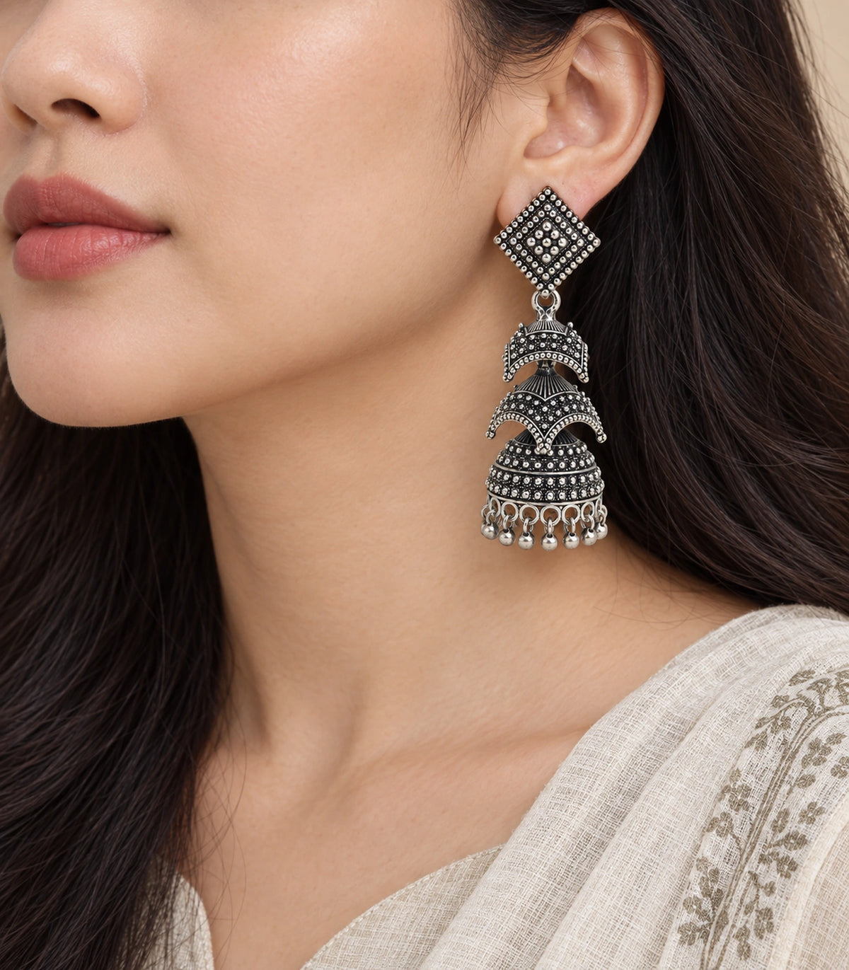 JIMIKI Oxidized Silver Tiered Chevron Jhumka Earrings - earrings worn with a cream outfit #color_oxidized-silver