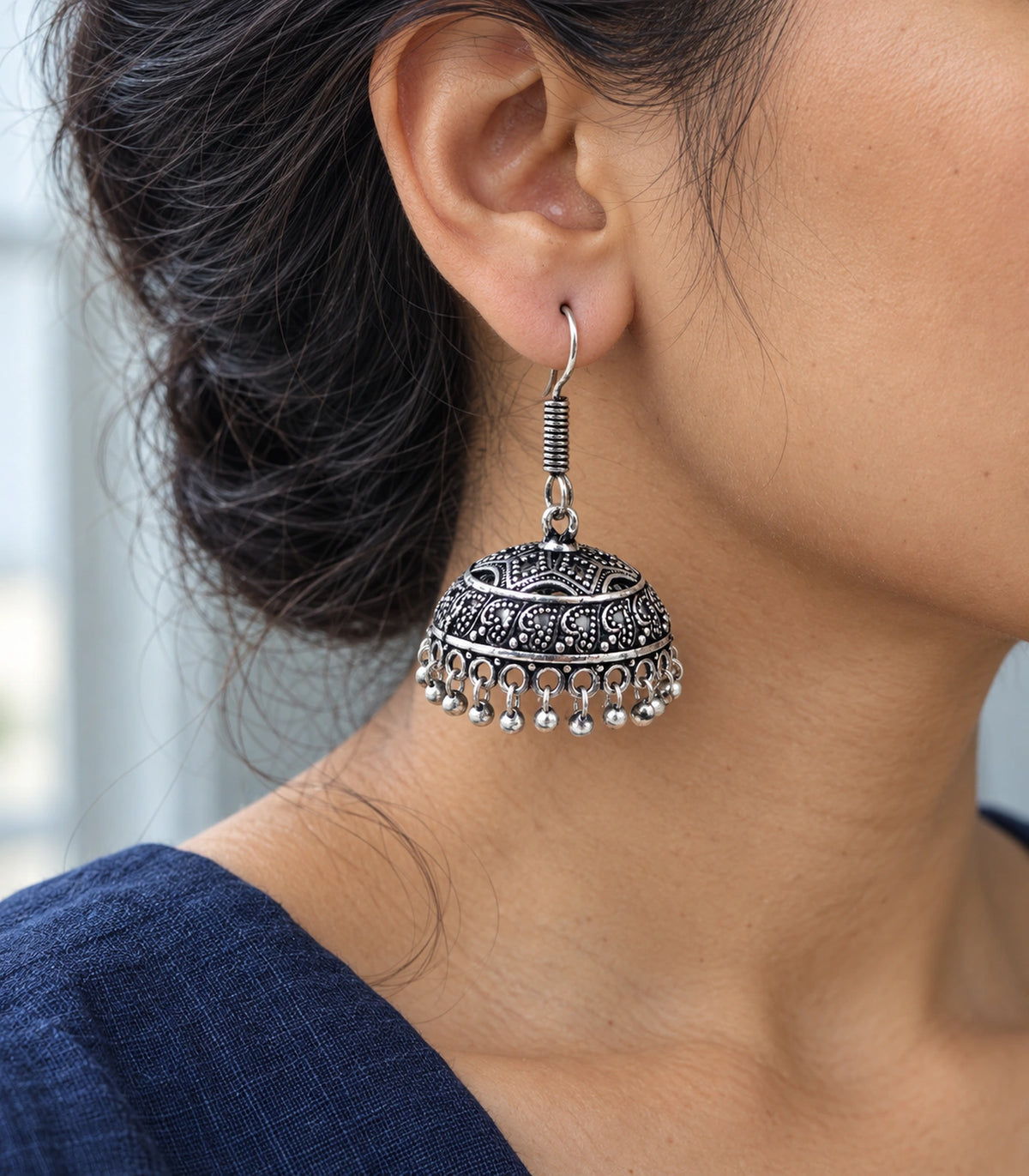 JIMIKI Oxidized Silver Wide Paisley Dome Hook Jhumka Earrings in Oxidized Silver - editorial worn view #color_oxidized-silver