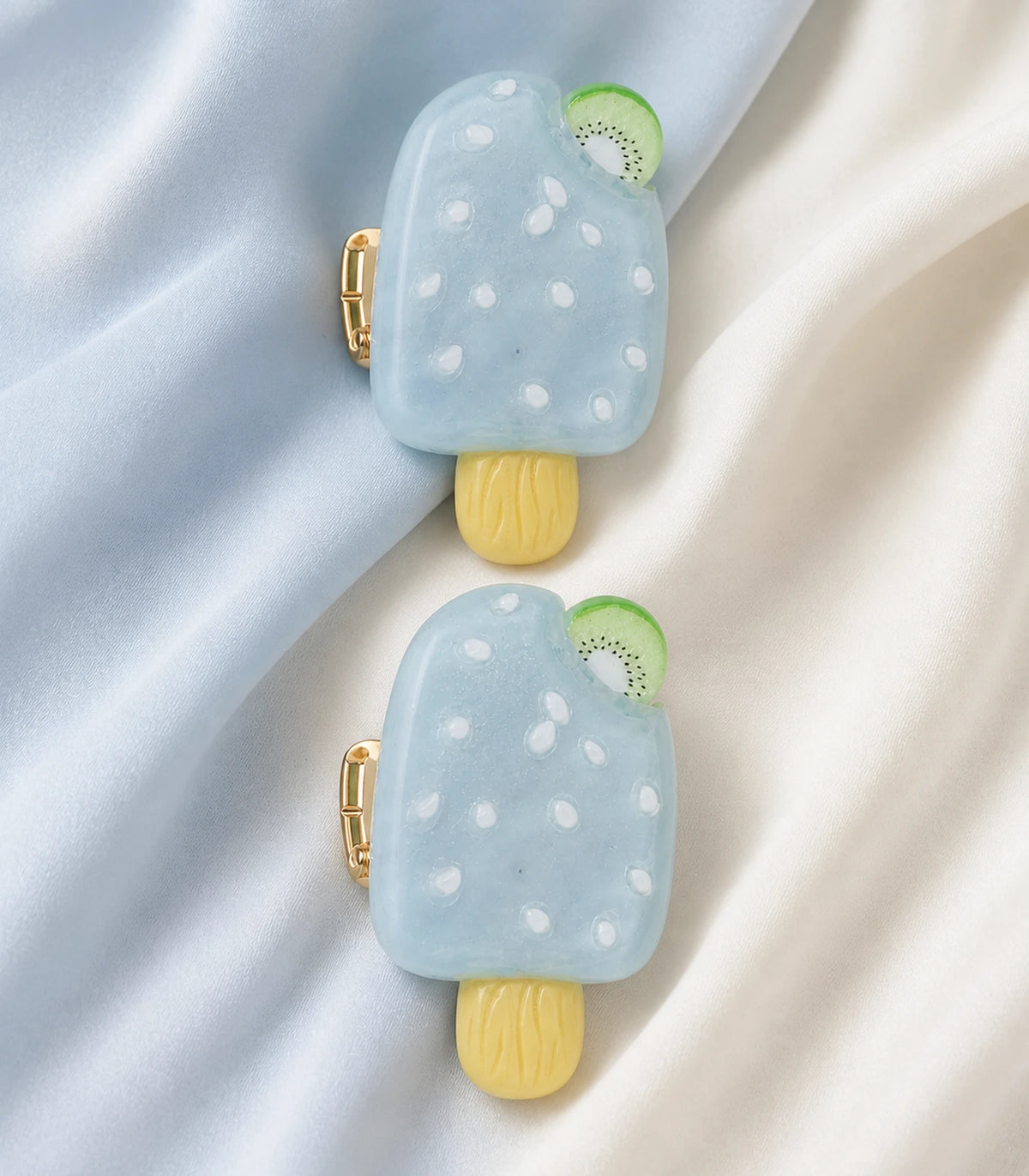 Close-up of the Pale Blue Kiwi Popsicle Clip Pair details
