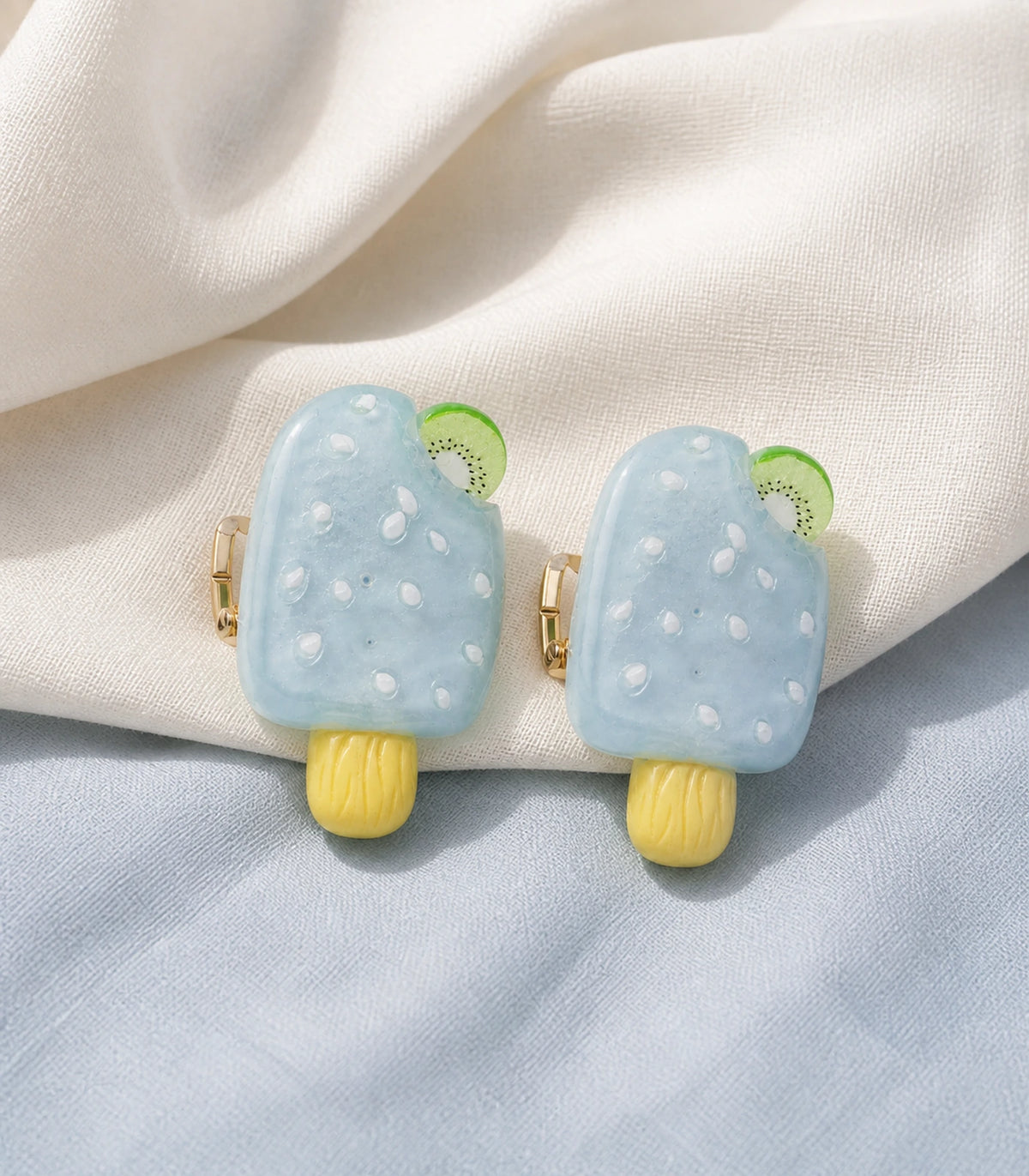 Editorial flat lay of the Pale Blue Kiwi Popsicle Clip Pair