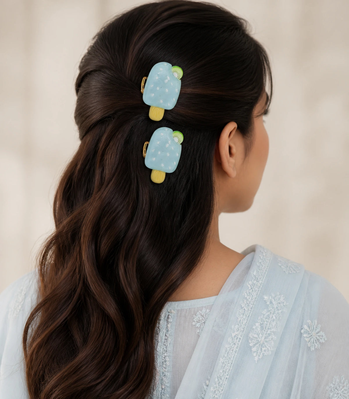 Editorial model view of the Pale Blue Kiwi Popsicle Clip Pair