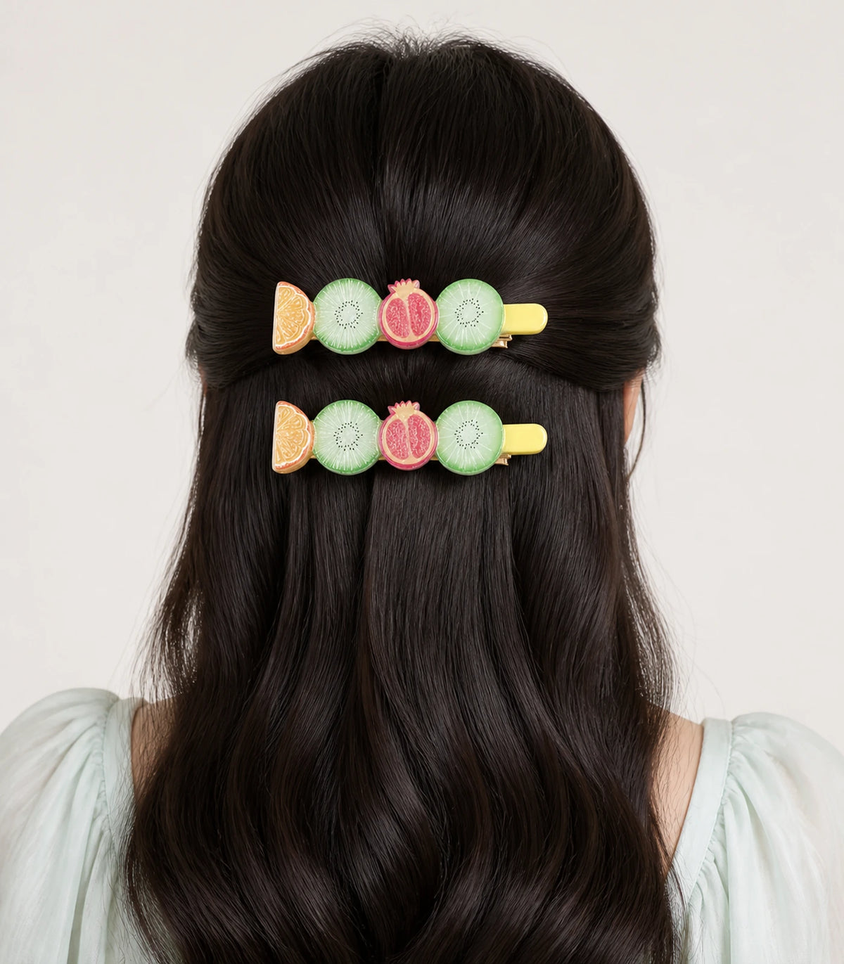 Model wearing the Pastel Citrus Mint Kiwi Pomegranate Barrette Pair