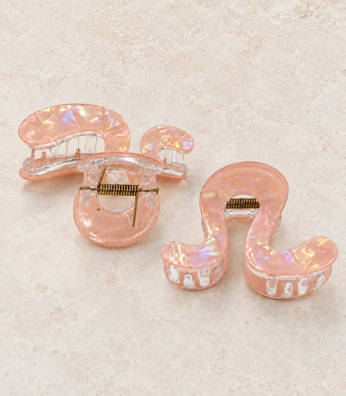 JIMIKI Iridescent S Shaped Hair Claw Clips in Peach, editorial flat lay #color_peach