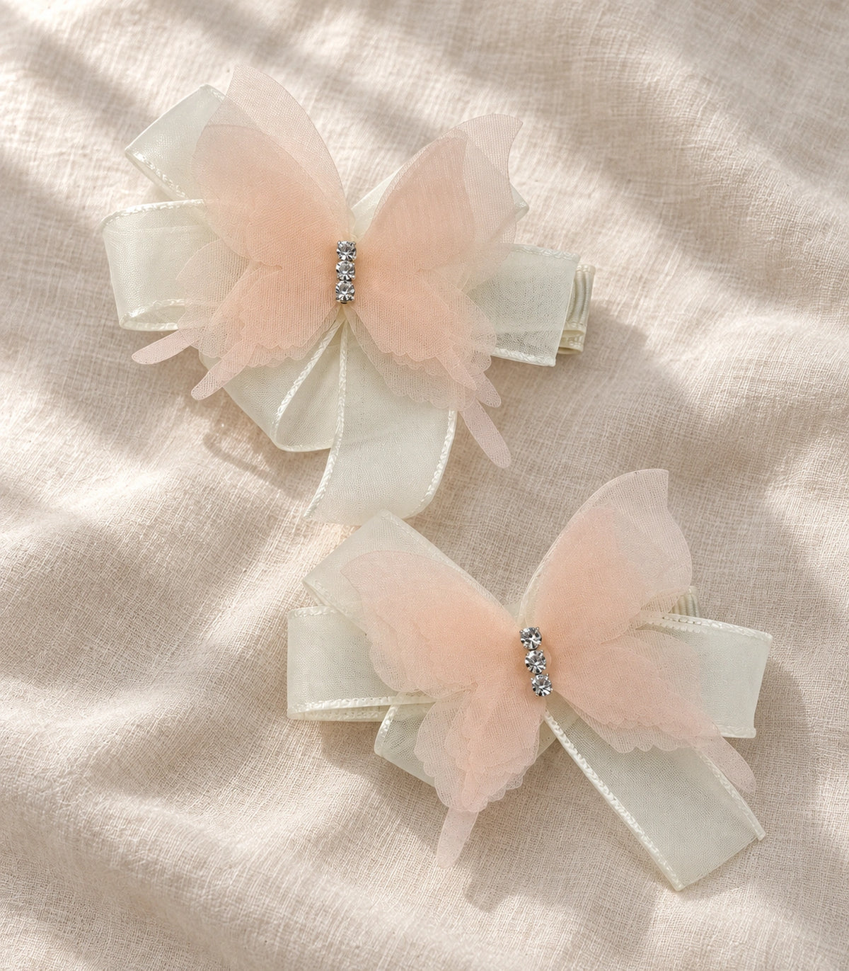 JIMIKI Organza Butterfly Bow Hair Clips in Peach, editorial flat lay #color_peach