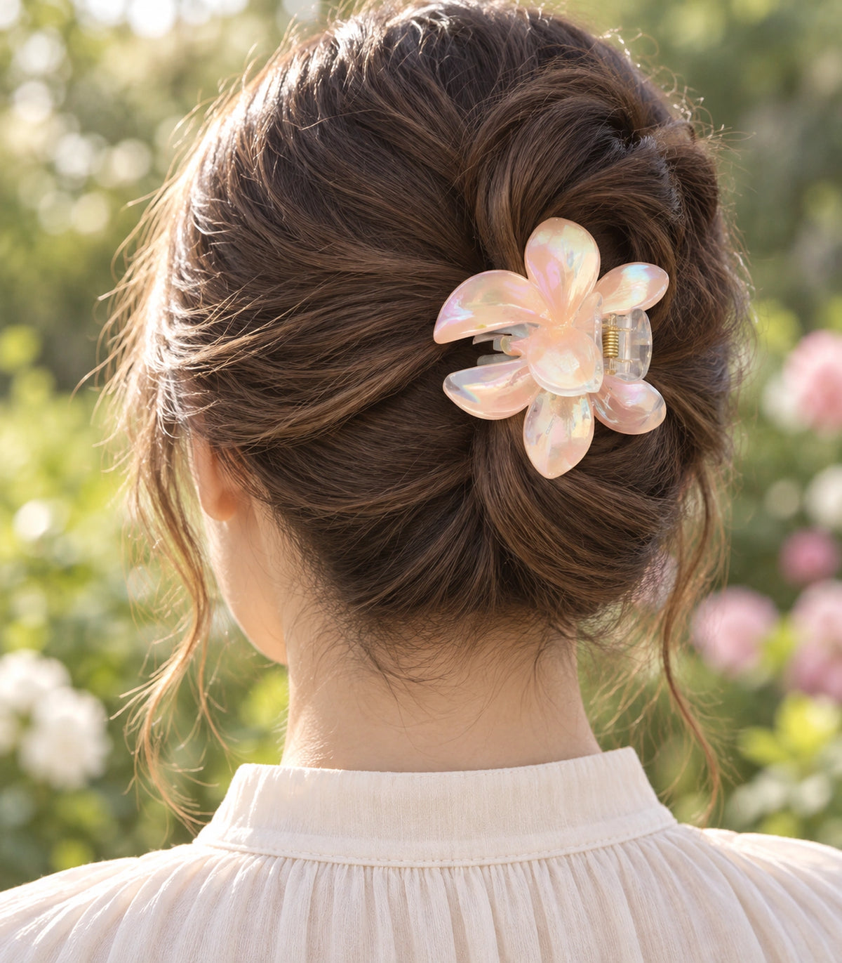 JIMIKI Iridescent Five Petal Flower Hair Claw Clips in Peach / Pink, editorial model view #color_peach / pink